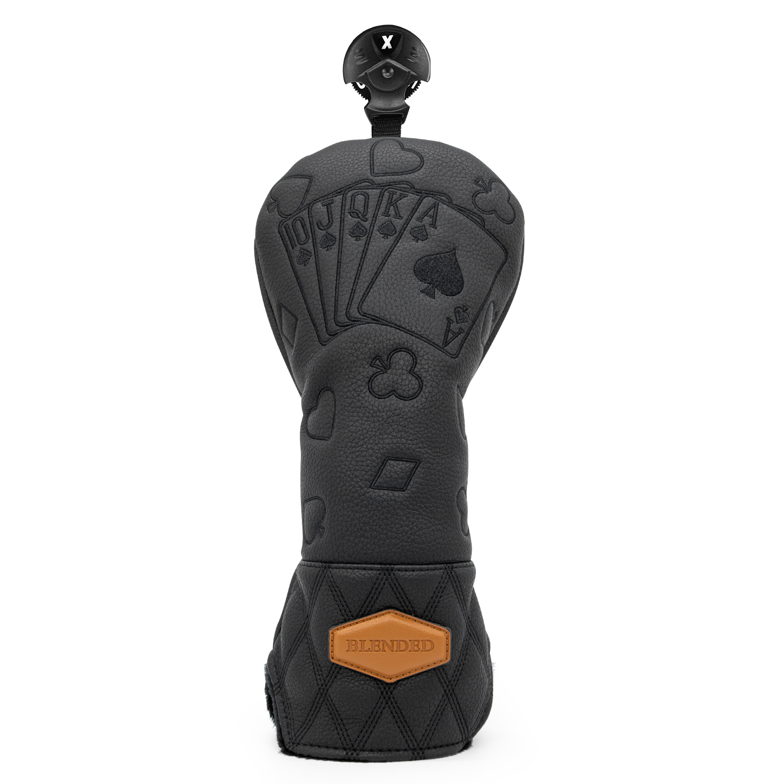 An upright black cover shows raised card-and-suit motifs and an orange label near the base.