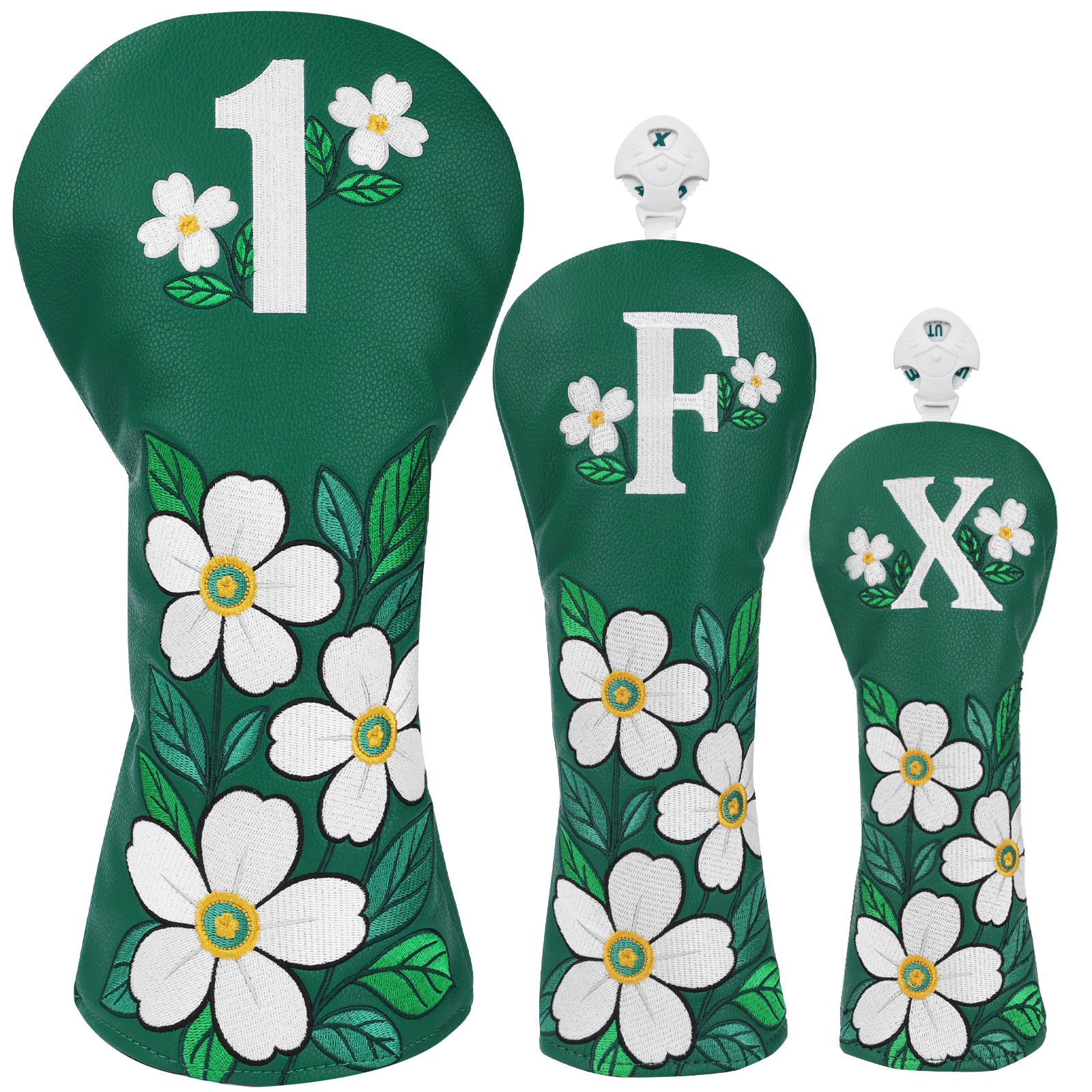 Three green covers decorated with white daisies and leaves, with large white “1,” “F,” and “X” markings.