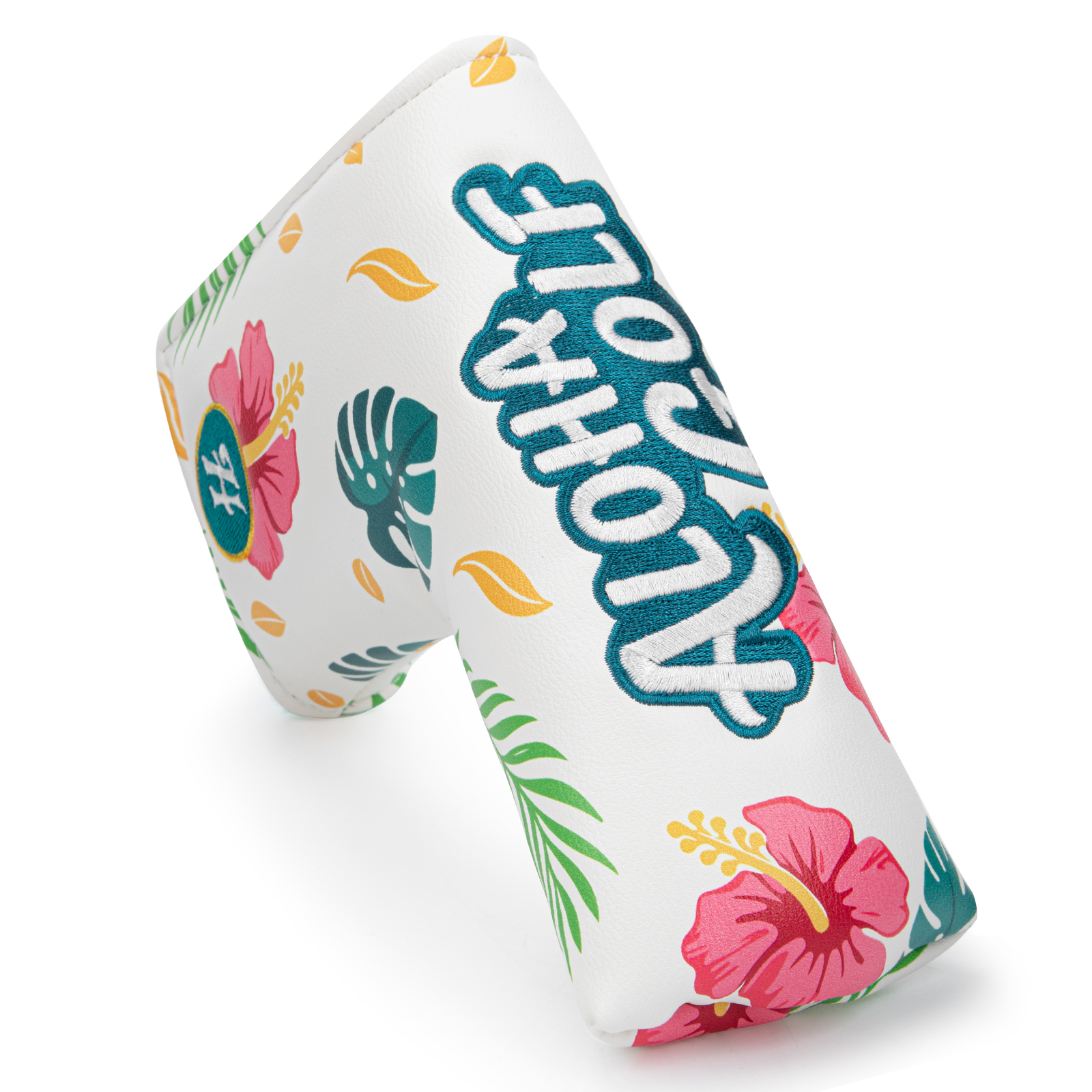 An angled view of a white cover with tropical flowers, teal leaves, and large “ALOHA GOLF” lettering.