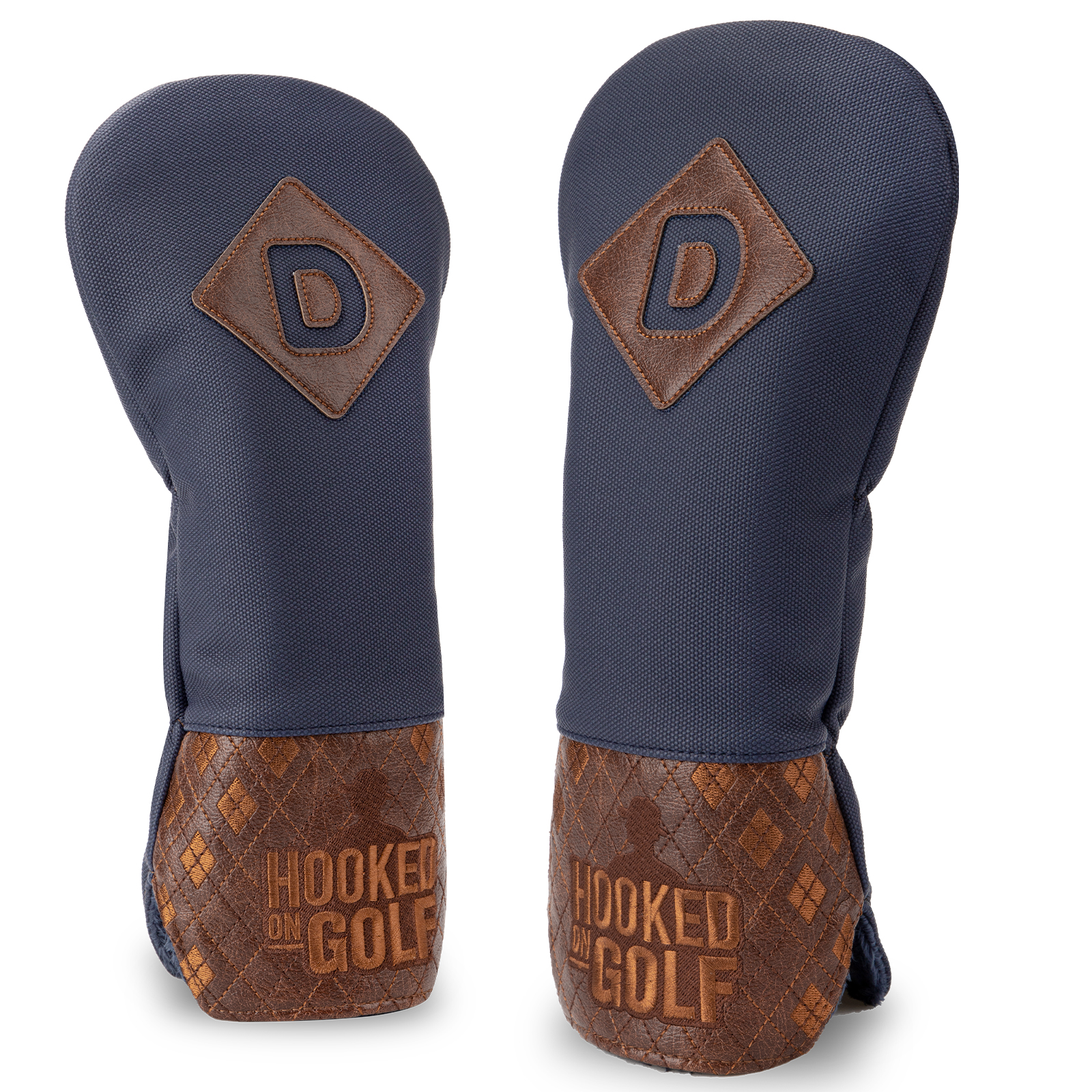 Two navy covers viewed from the front and side, with brown diamond patches marked “D” and patterned lower panels.