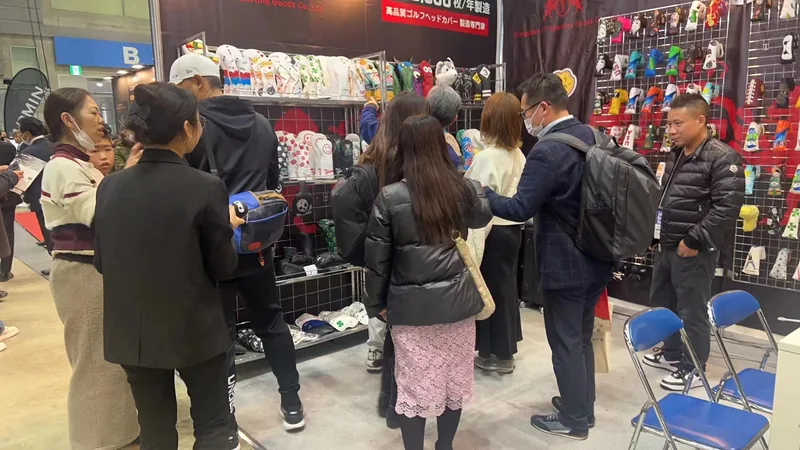 People browsing accessories at an indoor display