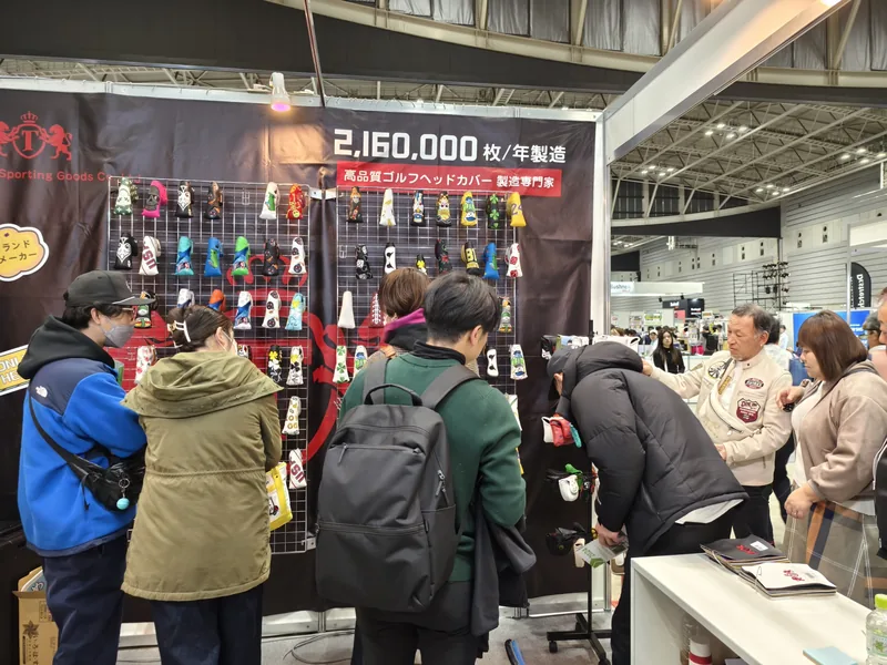 People gathered around accessories at an indoor display