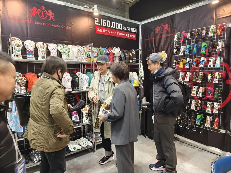 People examining accessories at an indoor display