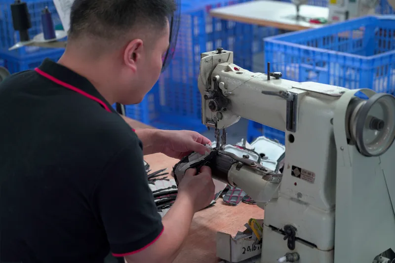 Operator sewing a fabric piece